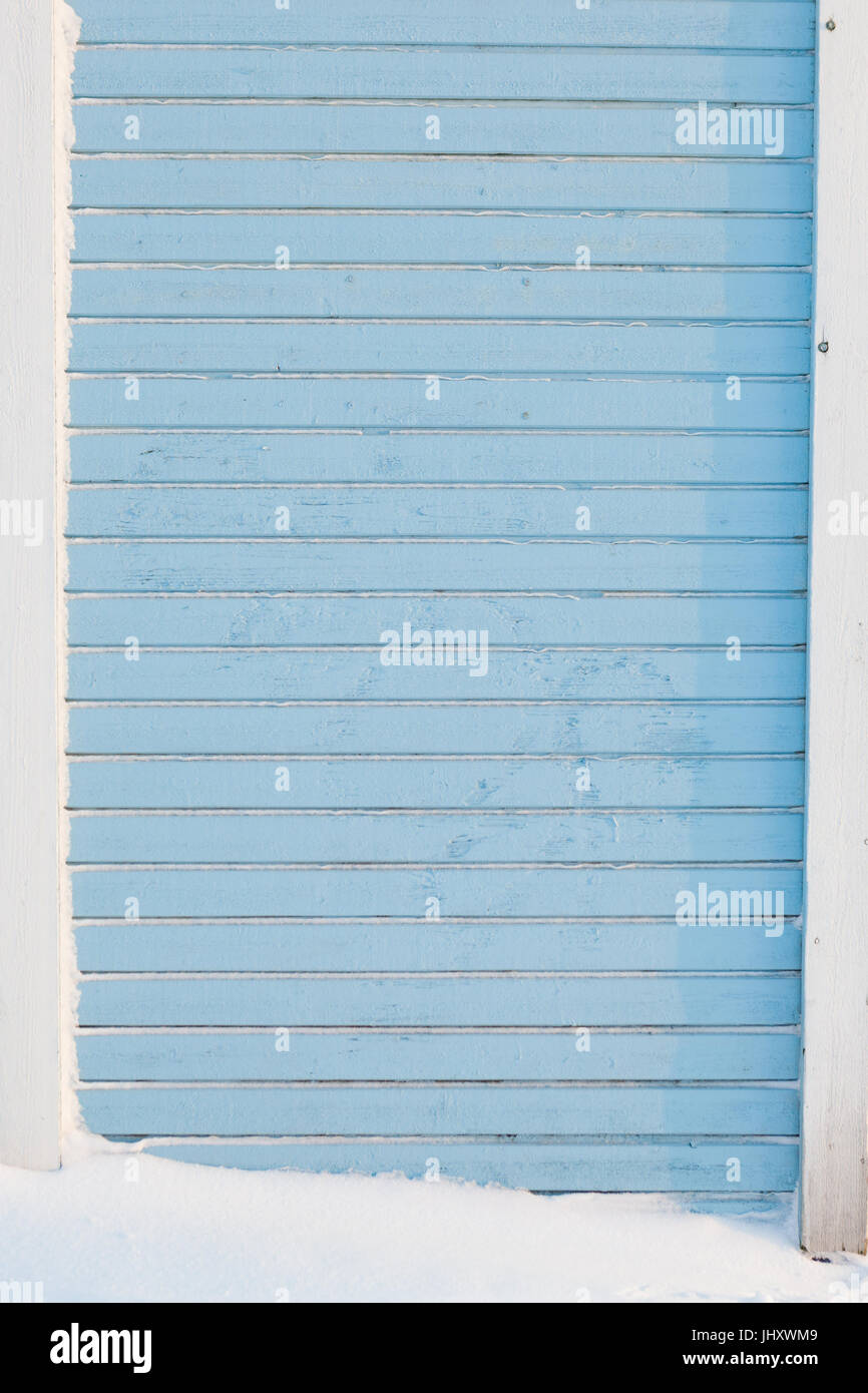 Light blue board wall exterior at winter Stock Photo