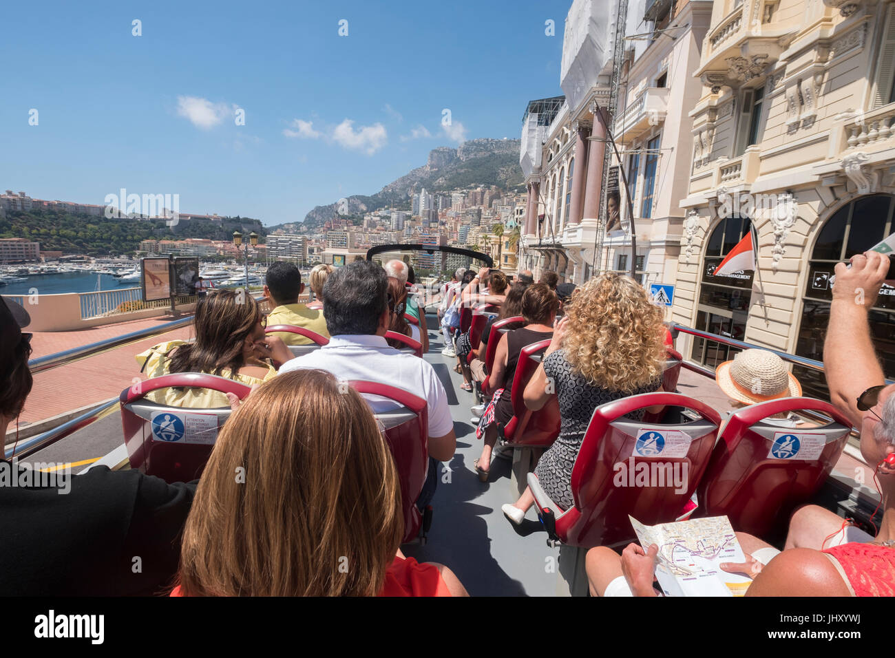 Tourists on a guided tour with a Hop on Hop off bus, Monte Carlo, Monaco. Stock Photo