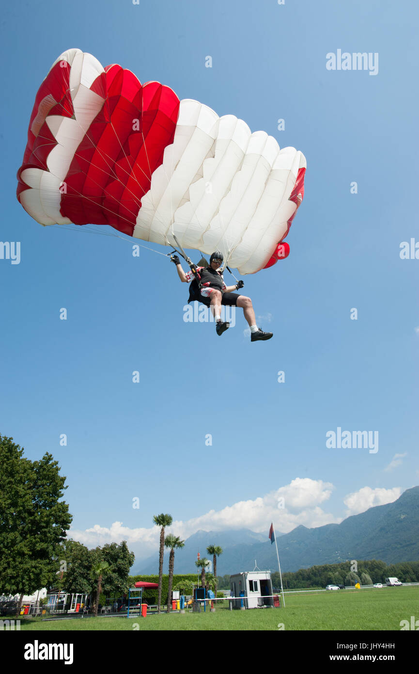 A skydiver practicing accuracy landing in Gordola, Switzerland Stock Photo