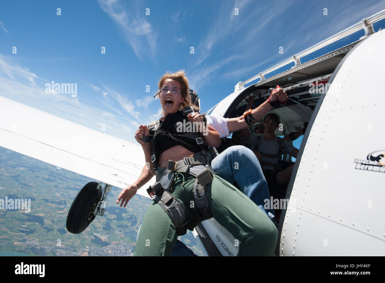 Girl doing a first tandem skydive Stock Photo