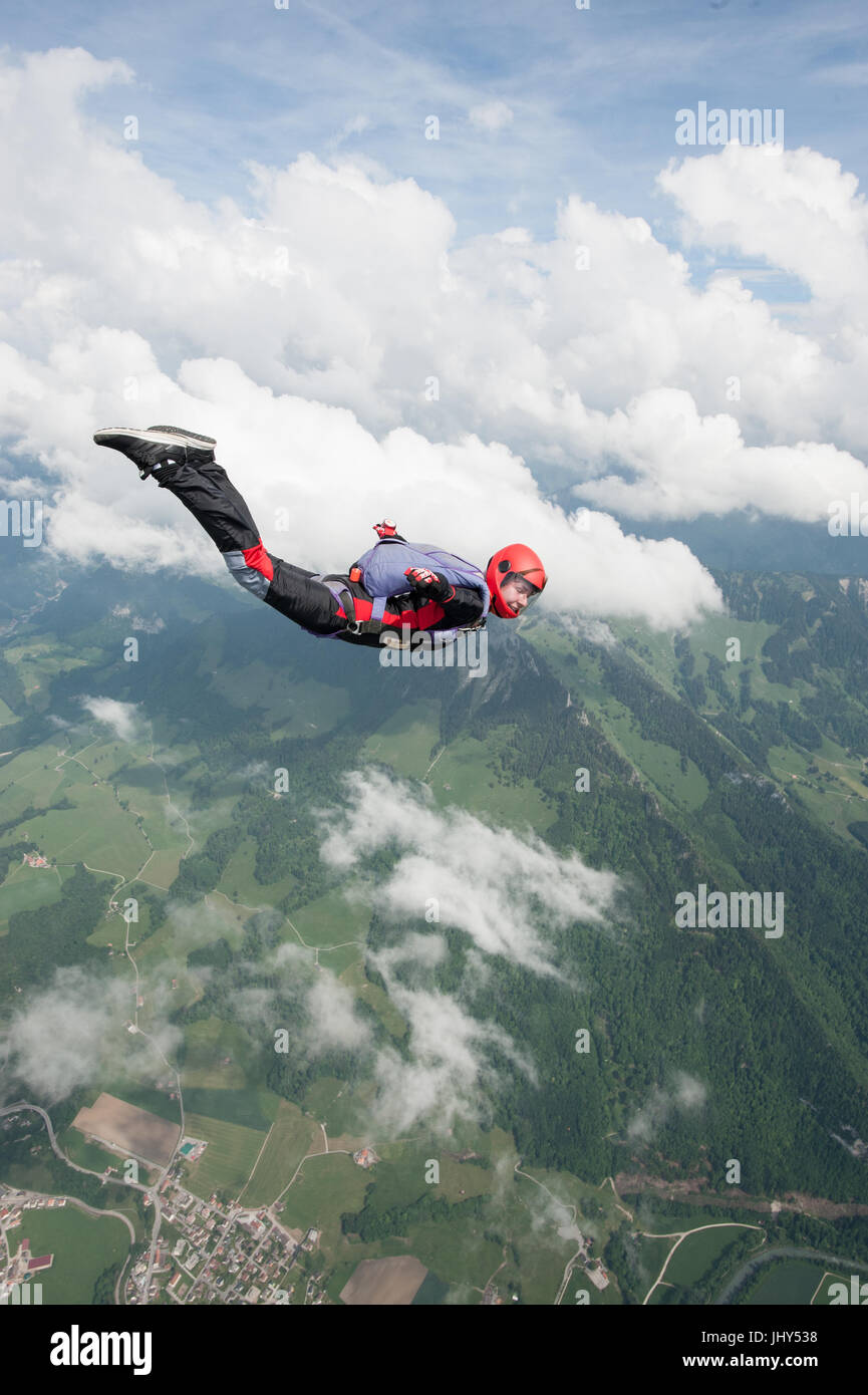 Student skydiver doing a practice jump above Gruyere in Switzerland Stock Photo