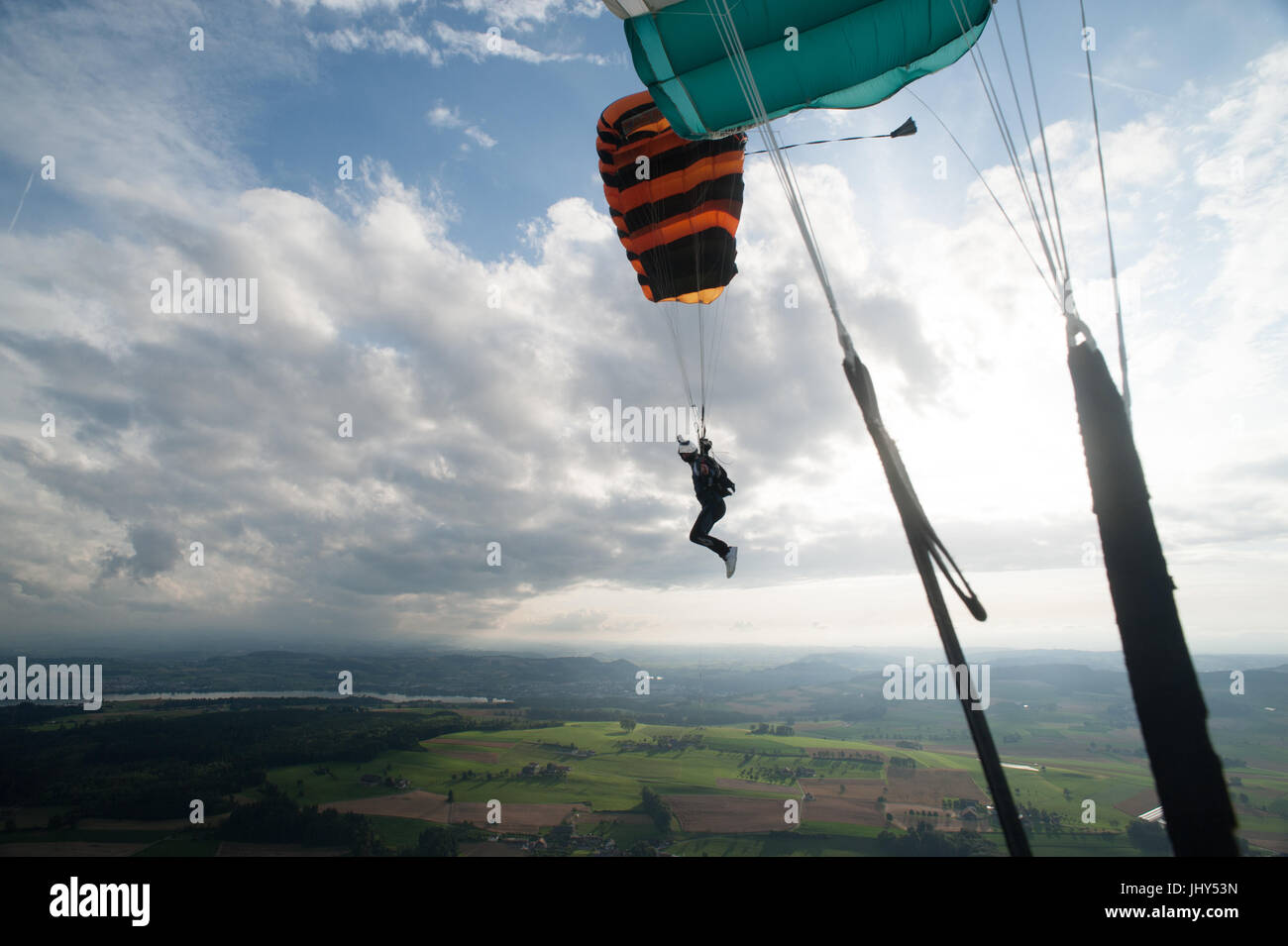 Skydiver flying towards the landing zone at Beromunster airport in Switzerland Stock Photo