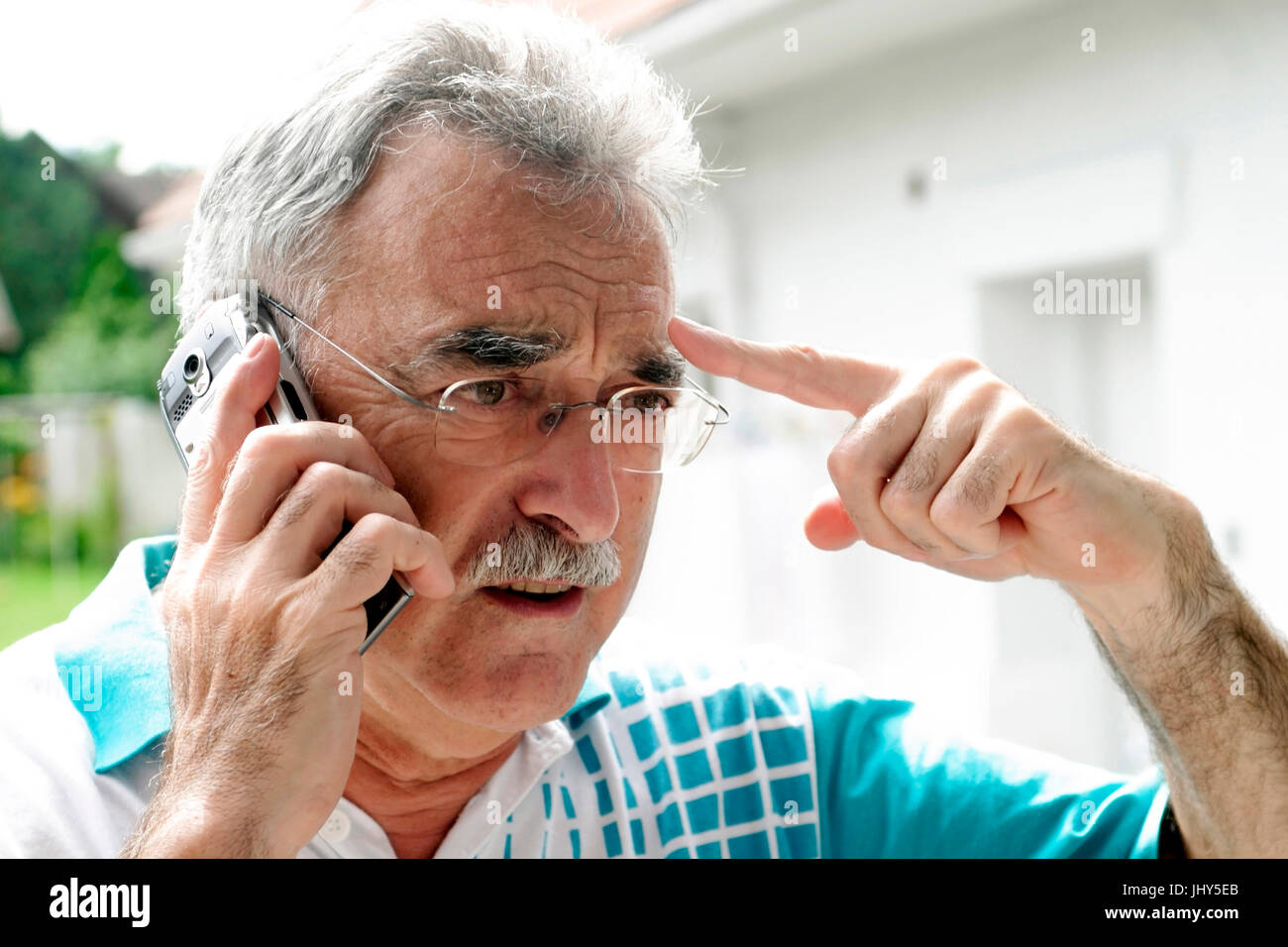 Man calls up mobile phone, Mann telefoniert mit Handy Stock Photo