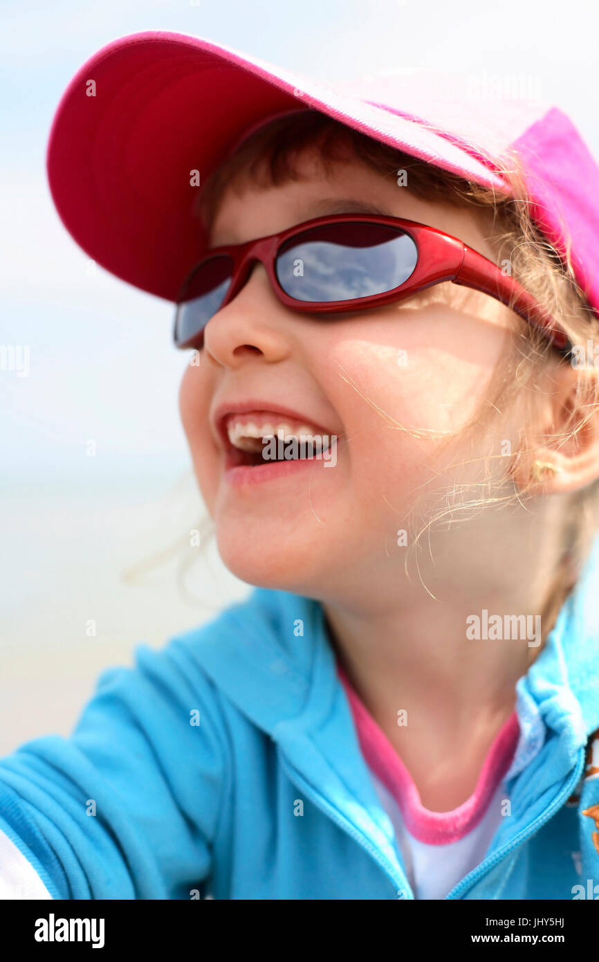 Laughing girl with sunglasses, Lachendes Maedchen mit Sonnenbrille Stock Photo