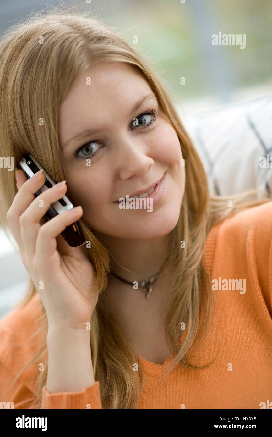 Young woman calls up the mobile phone, Junge Frau telefoniert mit dem Handy Stock Photo