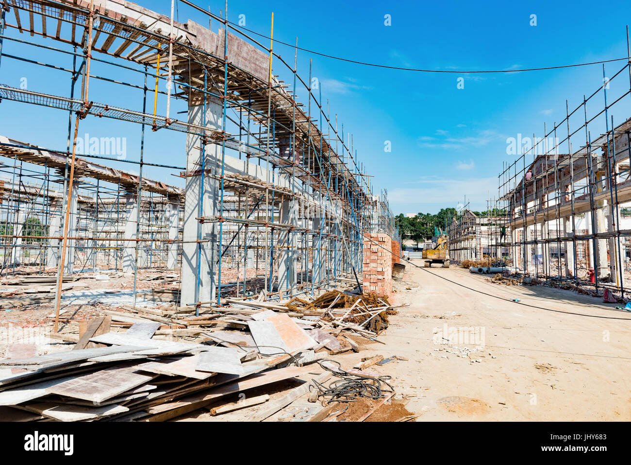 Demolition of old buildings under blue sky Stock Photo - Alamy