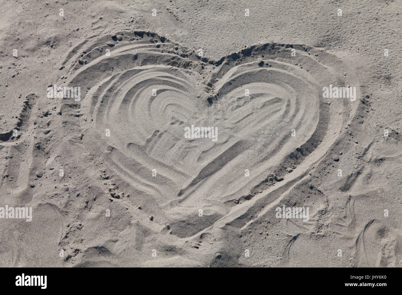 Heart in the sandy beach - heart in sandy beach, Herz im Sandstrand - heart in sandy beach Stock Photo