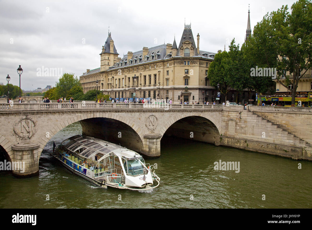 Tourist boat under a bridge on his, Paris, France - tourist boat, his river, Paris, France, Touristenboot unter einer Brücke auf der Seine, Frankreic Stock Photo