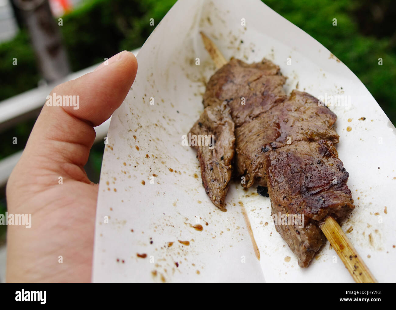 Grilled beef in the hand, street foods on street in Kyoto, Japan Stock