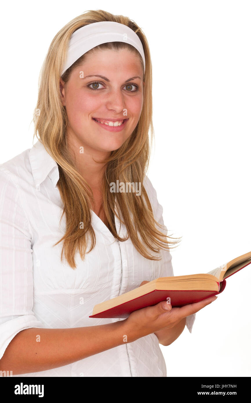 Young woman reads a book - Young woman is reading a book, Junge Frau liest ein Buch - Young woman is reading a book Stock Photo