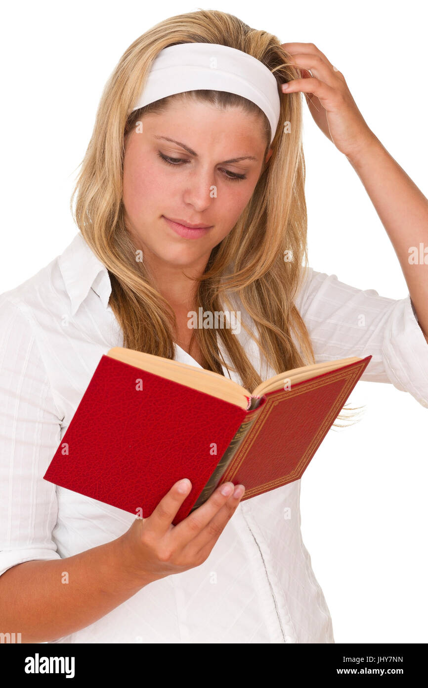 Young woman reads a book - Young woman is reading a book, Junge Frau liest ein Buch - Young woman is reading a book Stock Photo