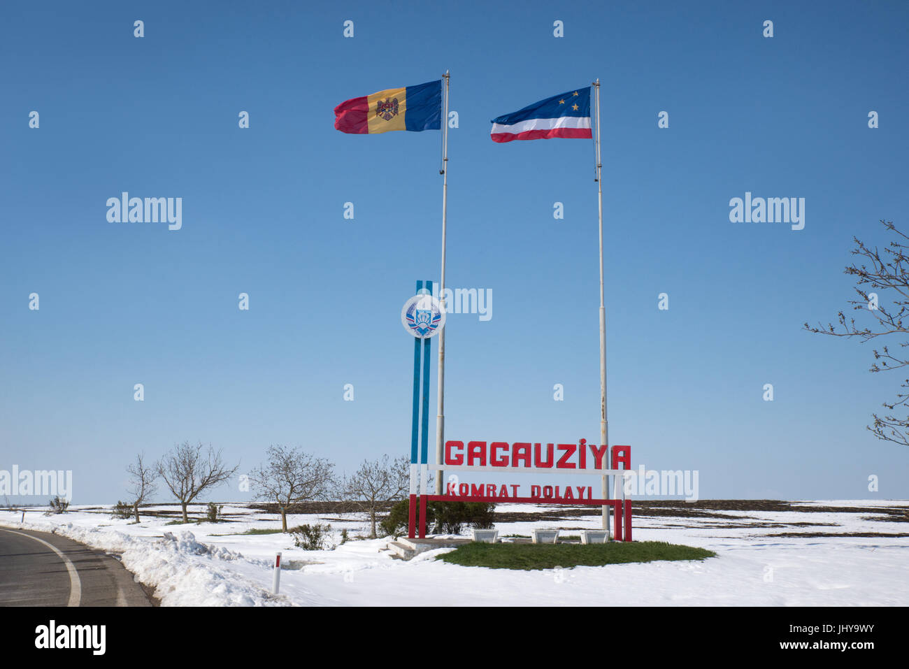 Moldovan and Gagauz flags fly at the 'Welcome to Gagauzia' sign at border of the autonomous region of Gagauzia Stock Photo