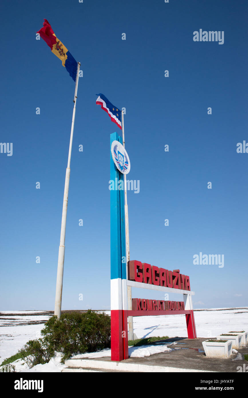 Moldovan and Gagauz flags fly at the 'Welcome to Gagauzia' sign at border of the autonomous region of Gagauzia Stock Photo