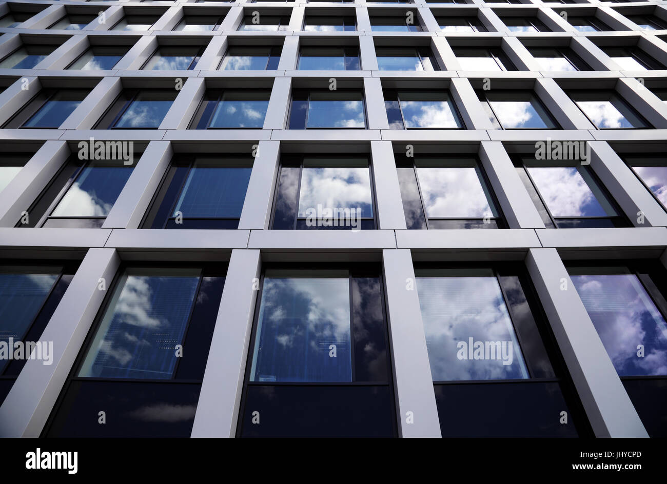 glass office building with clouds Stock Photo - Alamy