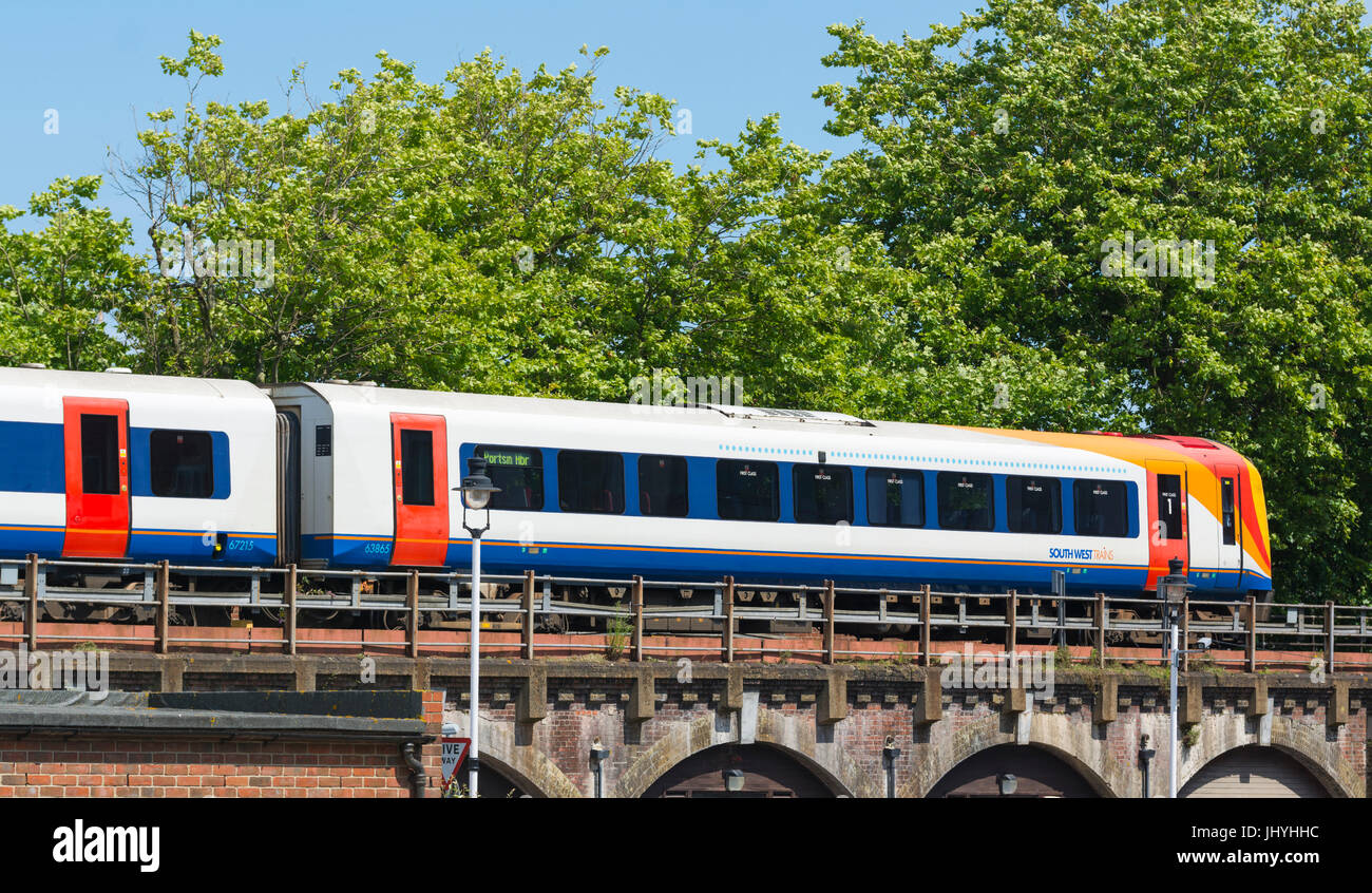 South West Train travelling over a bridge in Hampshire, England, UK. Stock Photo