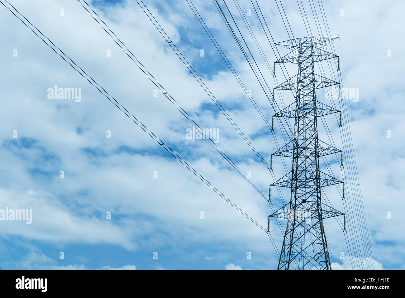 high voltage pole blue sky background Stock Photo - Alamy