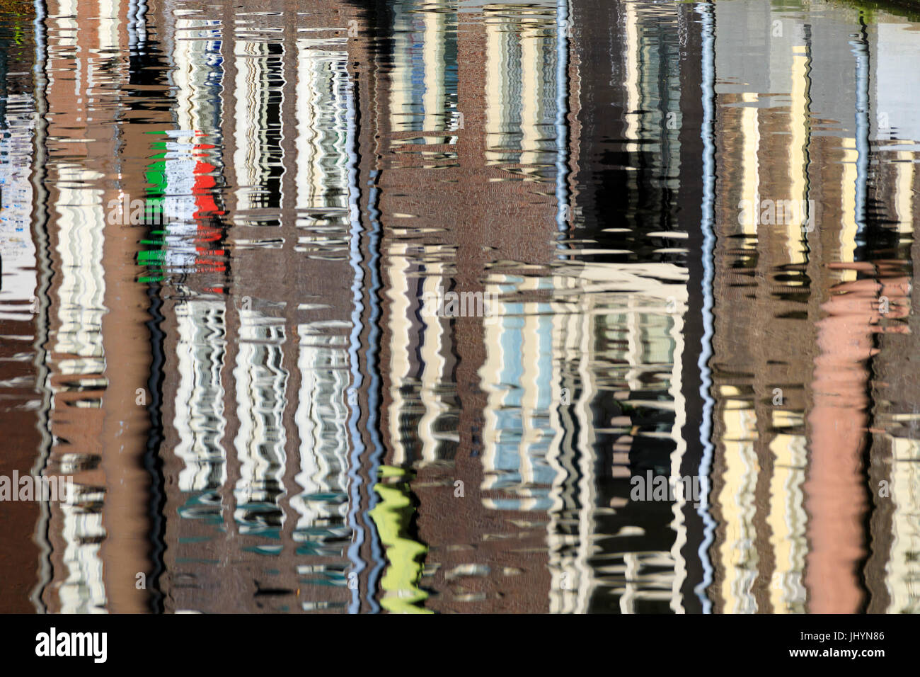 Abstract details of buildings reflected in a typical canal of the river Amstel, Amsterdam, Holland (The Netherlands), Europe Stock Photo