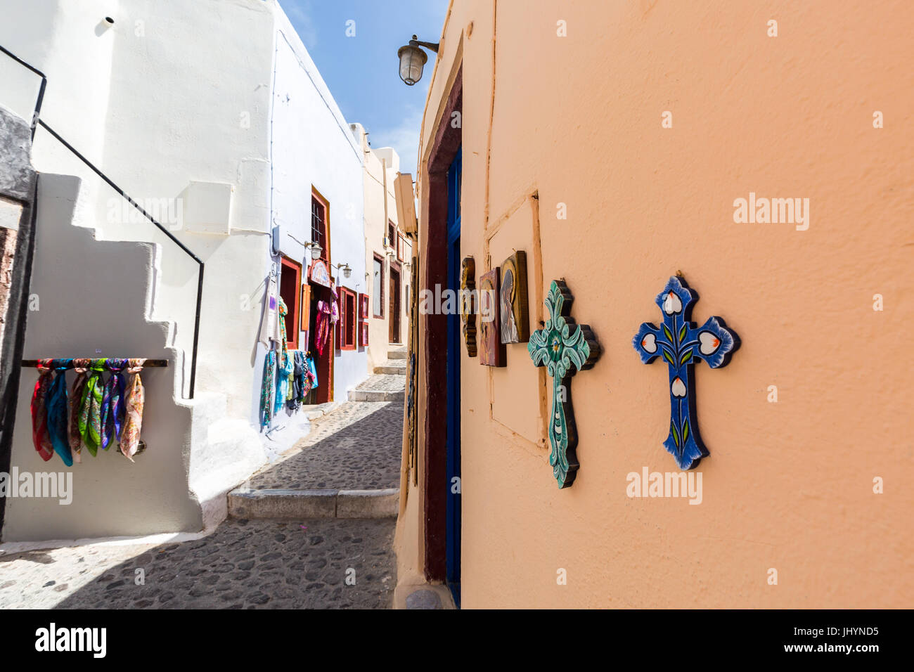 Souvenir crosses on the outside of a shop on a street in Oia, Santorini, Cyclades, Greek Islands, Greece, Europe Stock Photo