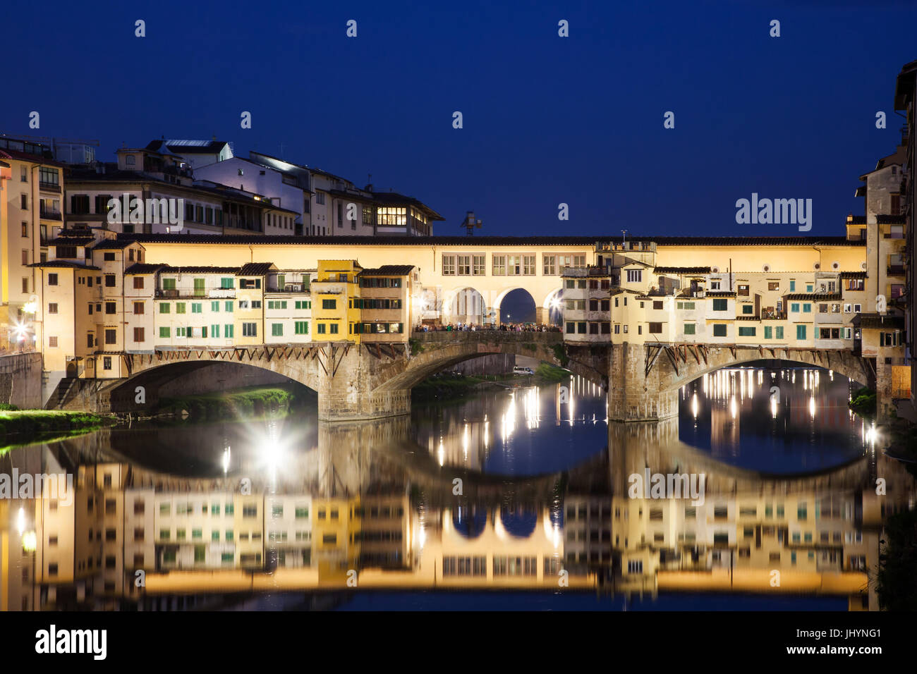 Ponte Vecchio at night reflecting in River Arno, Florence, UNESCO World Heritage Site, Tuscany, Italy, Europe Stock Photo