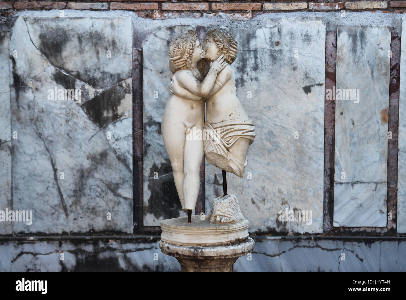OSTIA ANTCA, ITALY -  JULY  2, 2017: Ancient Roman statue in Ostia town, Cupido and Psyche kissing, 2nd century AD. Room E of the House of Cupid and P Stock Photo