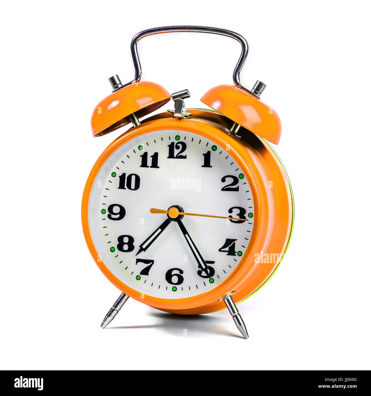 Yellow alarm clock against white background Stock Photo