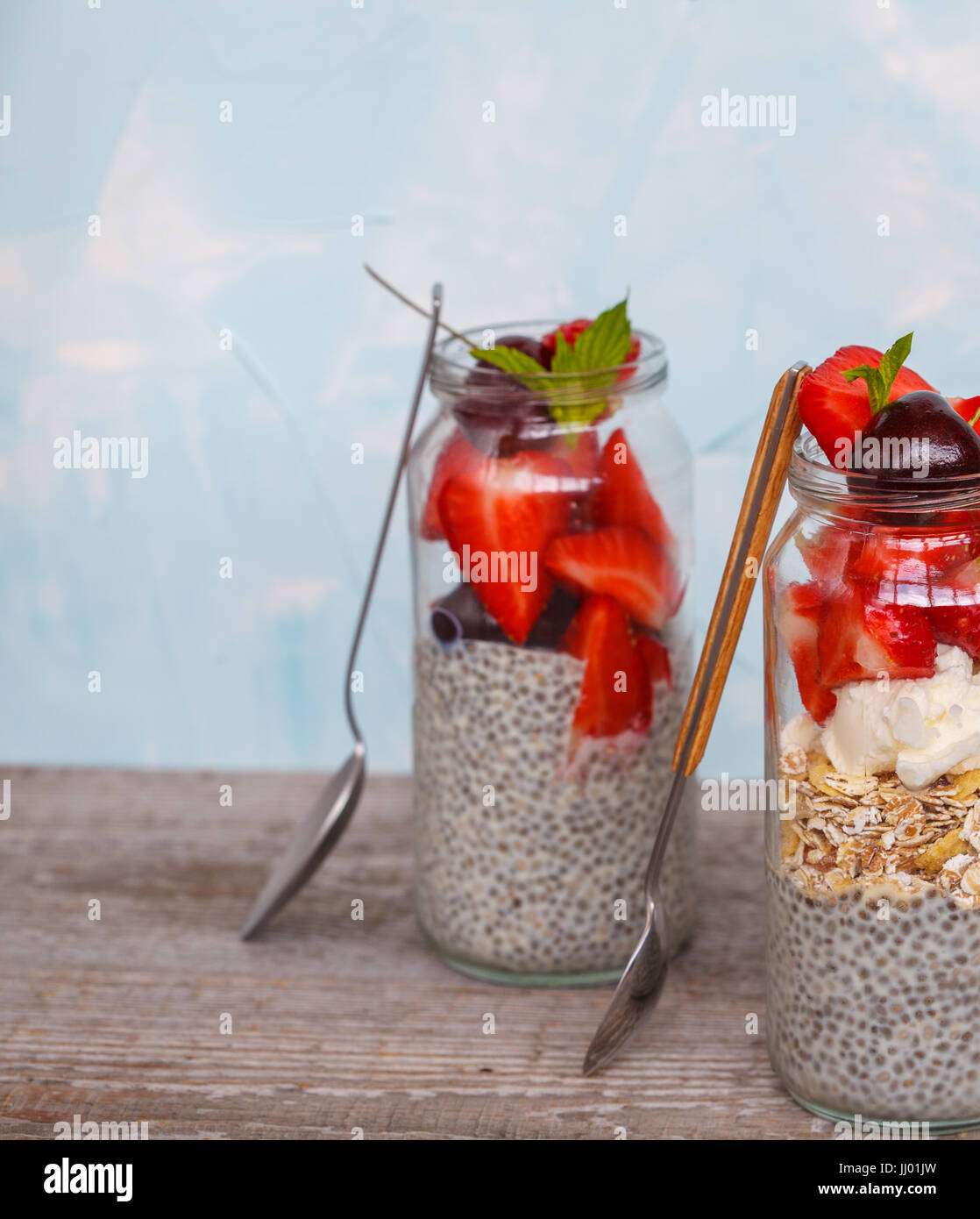 Chia pudding with strawberries, cherries and muesli. Love for a healthy