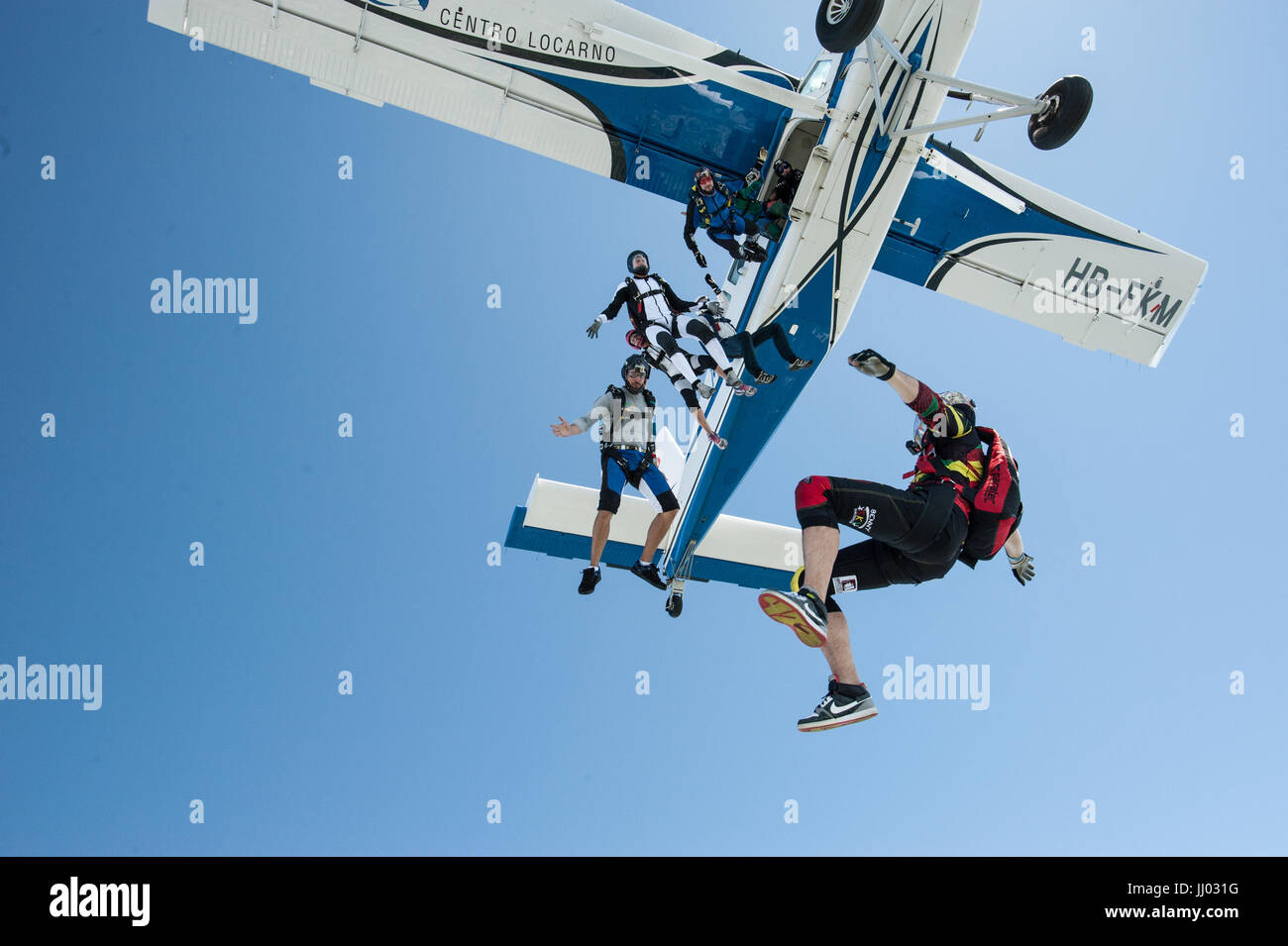 Skydivers Skydivers exiting a Pilatus Porter for a fun jump Stock Photo