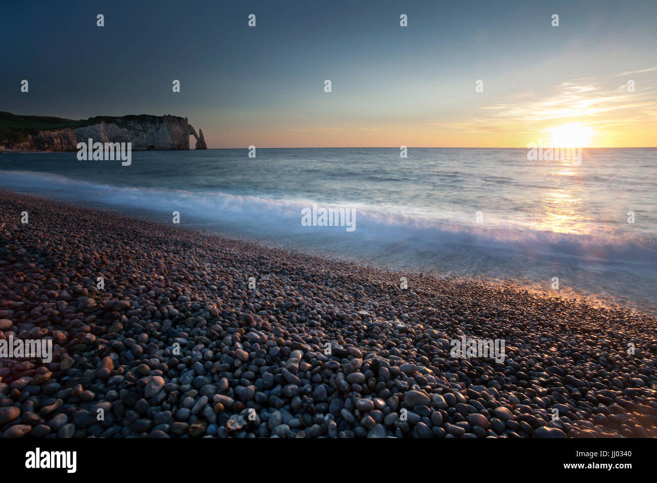 Sunset at Etretat beach Stock Photo - Alamy