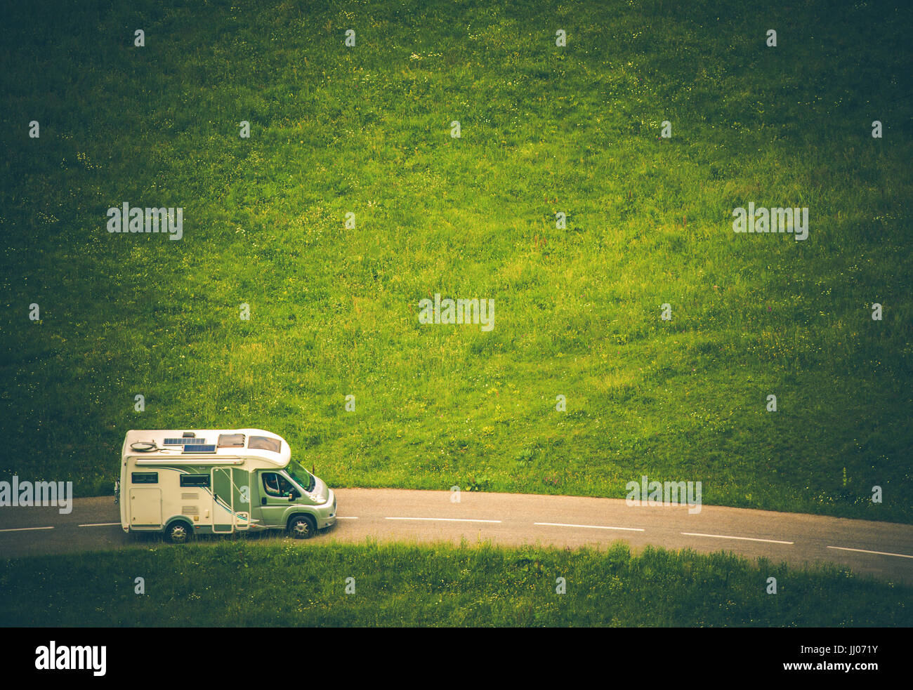 Motorhome Camper Van Travel. Class C RV on the Countryside Road. Aerial View. Stock Photo