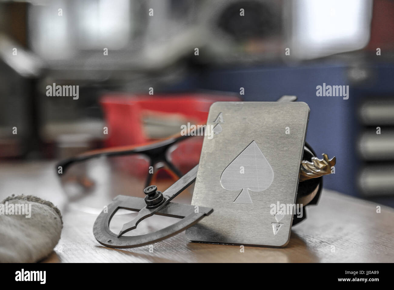 Angle meter tool and glasses in a workshop Stock Photo