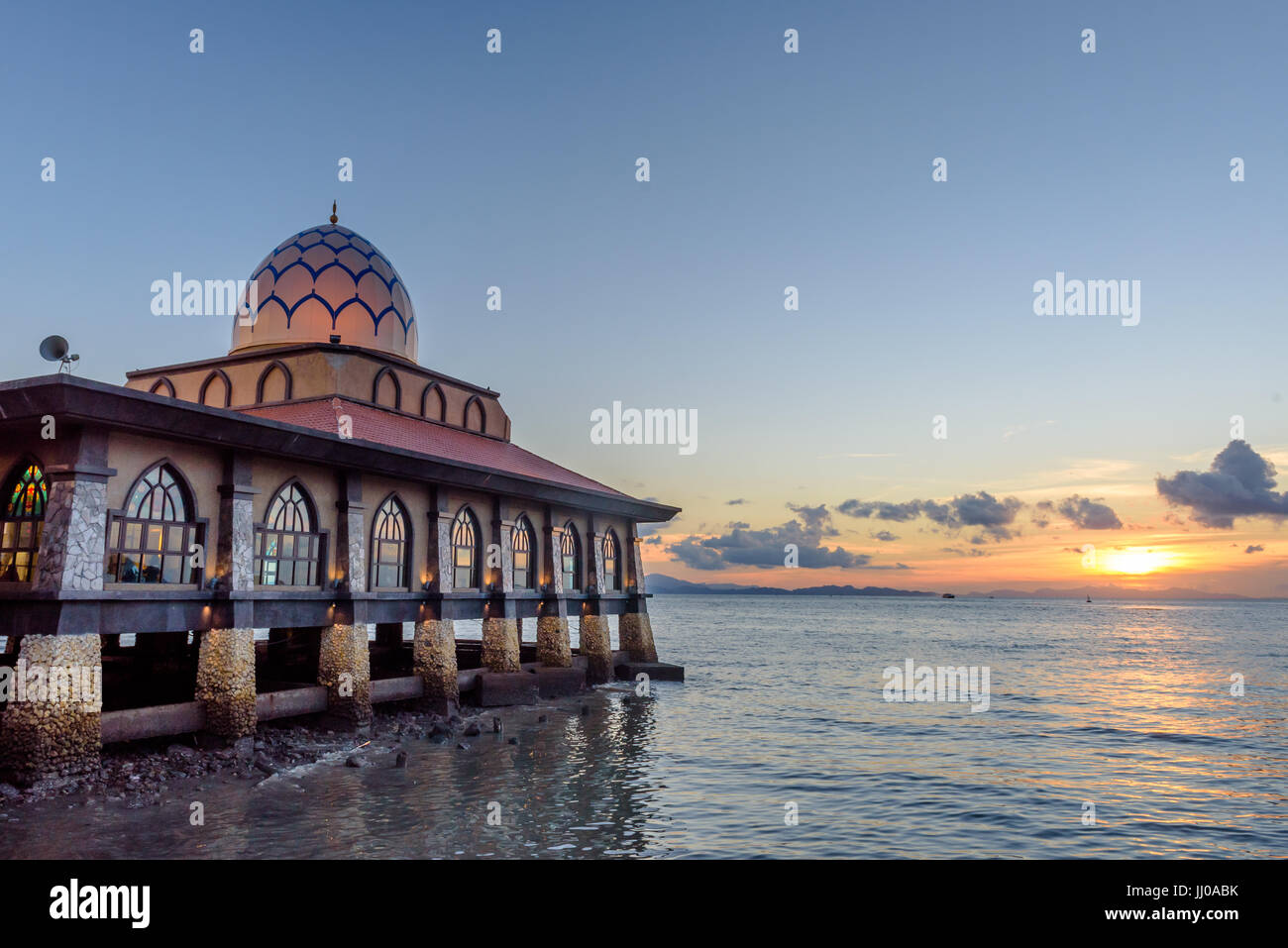 masjid al hussain a floating mosque extends over the Straits of Malacca in evening at kuala perlis, malaysia Stock Photo