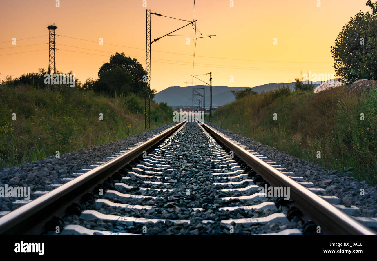 Vintage empty railroad at romantic sunset time Stock Photo - Alamy