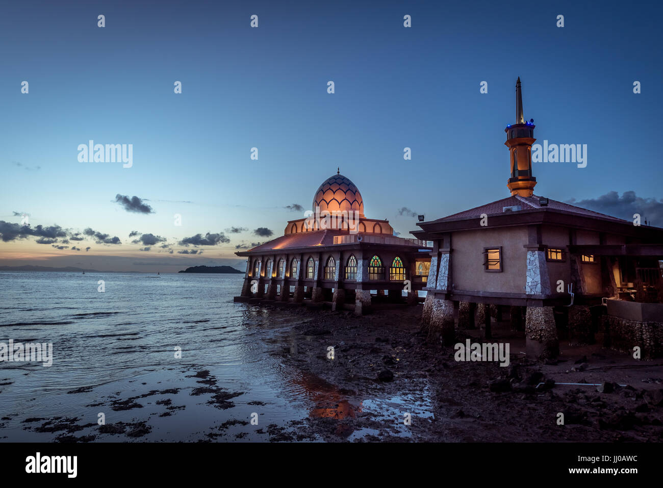 masjid al hussain a floating mosque extends over the Straits of Malacca in evening at kuala perlis, malaysia Stock Photo