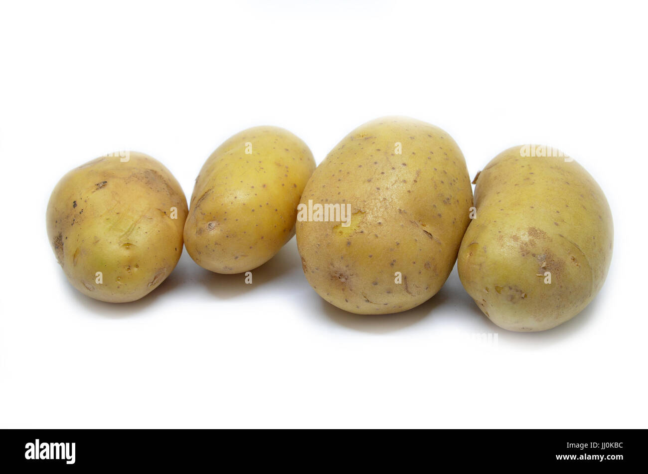Ratte potatoes heap isolated on a white background Stock Photo