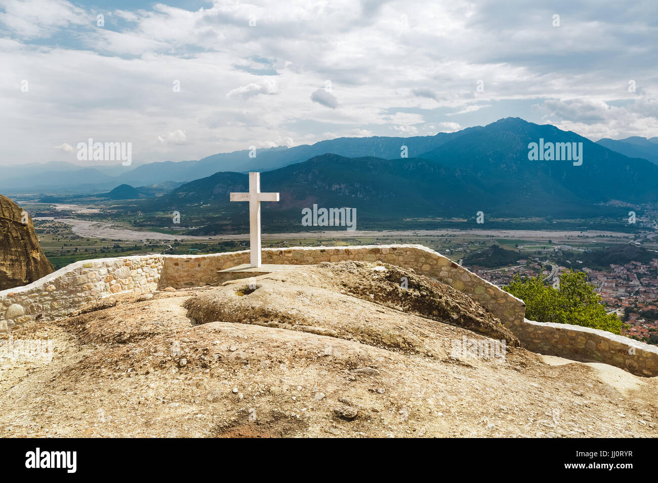 White cross in the Holy Trinity Monastery,  view to Kalambaka,  Meteora, Greece Stock Photo