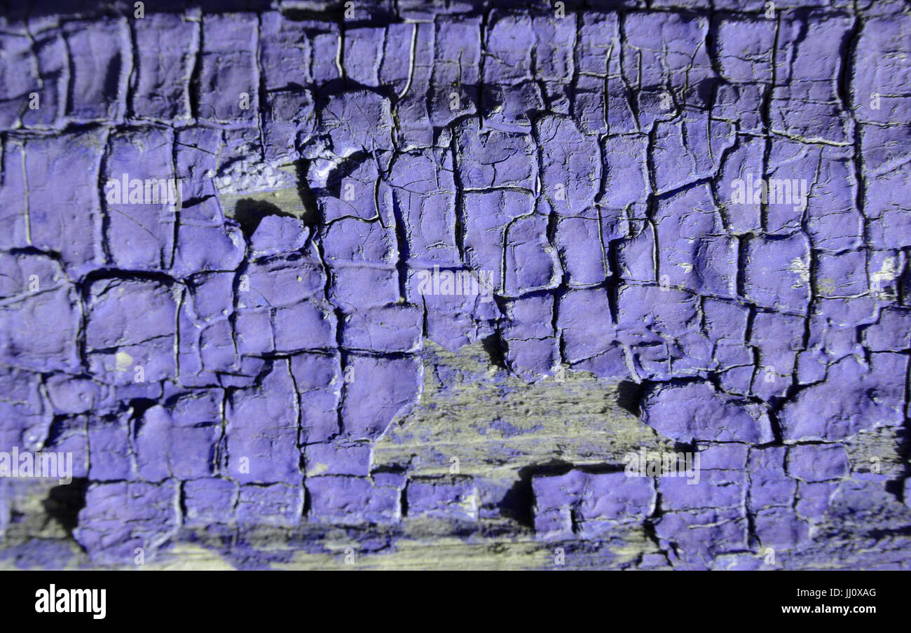 The texture of purple paint cracked on the wood Stock Photo