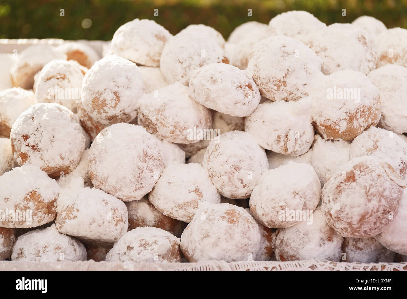 Homemade Kourabiedes covered with icing sugar, Greek  traditional Christmas butter cookies.A macro photograph with very shallow depth of field Stock Photo