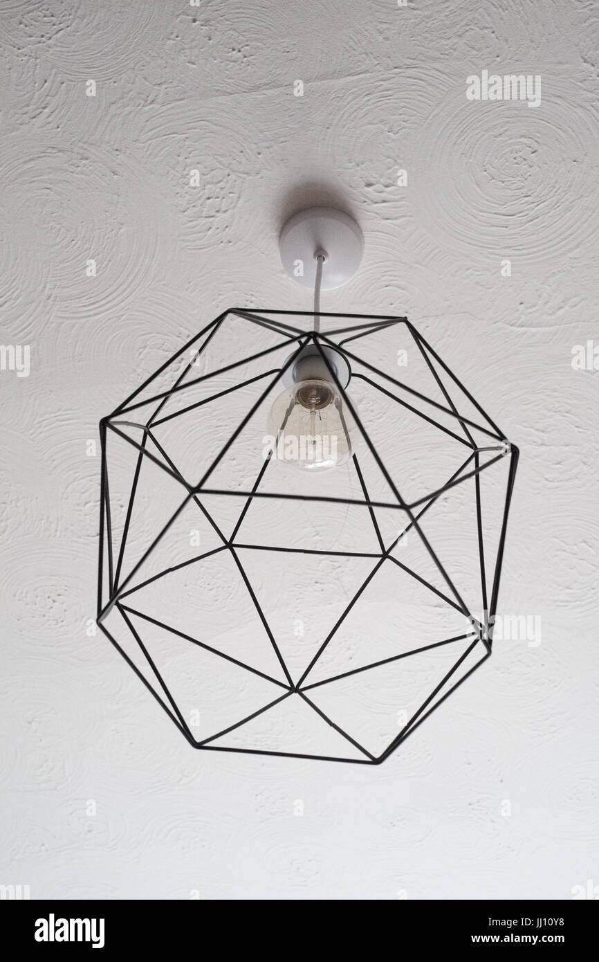 Geometrical wire light shade and vintage filament bulb Stock Photo Alamy