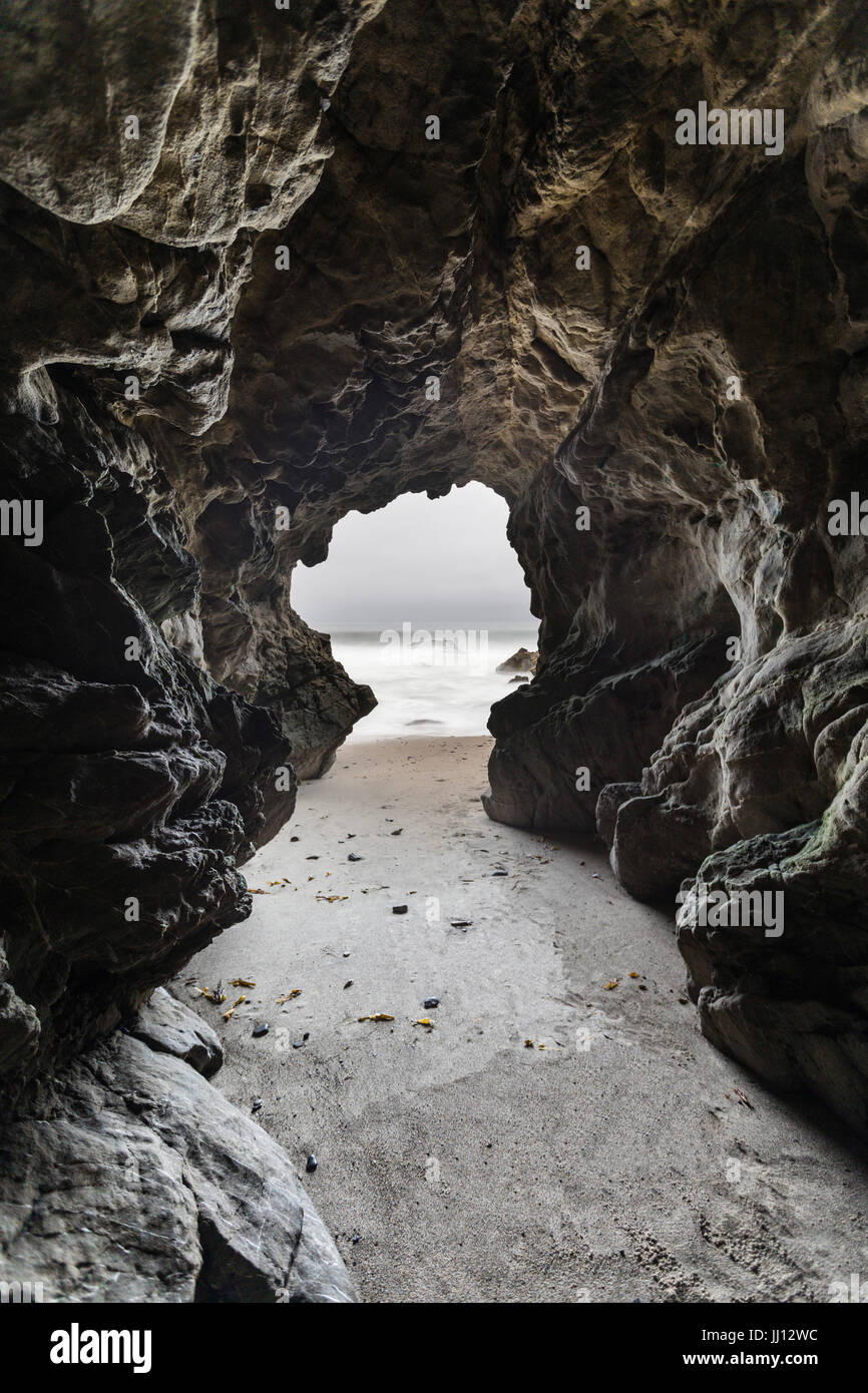 Sea cave with motion blur water at Leo Carrillo State Beach in Malibu, California. Stock Photo
