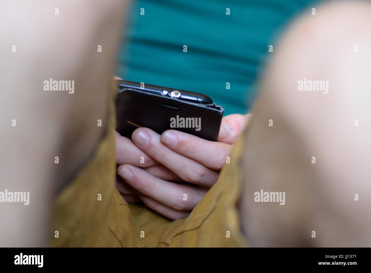 Texting Through Phone Guy using mobile texting message hi-res stock photography and images ...