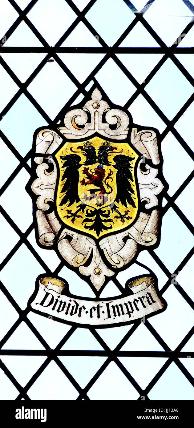 Divide et Impera, Divide and Rule, heraldic stained glass, East Barsham Manor, Norfolk 2 Stock Photo
