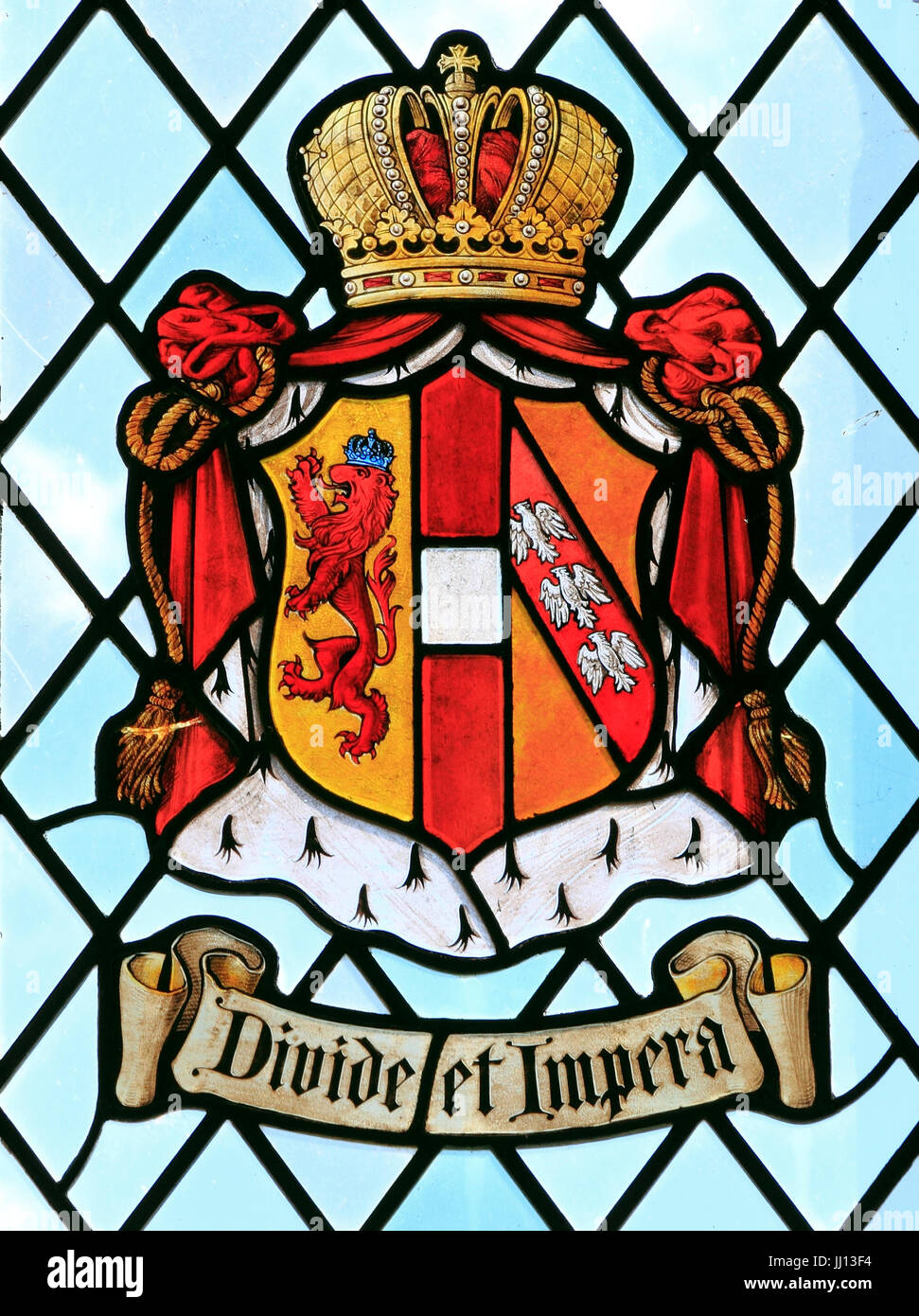 Divide et Impera, Divide and Rule, heraldic stained glass, Easr Barsham Manor, Norfolk Stock Photo