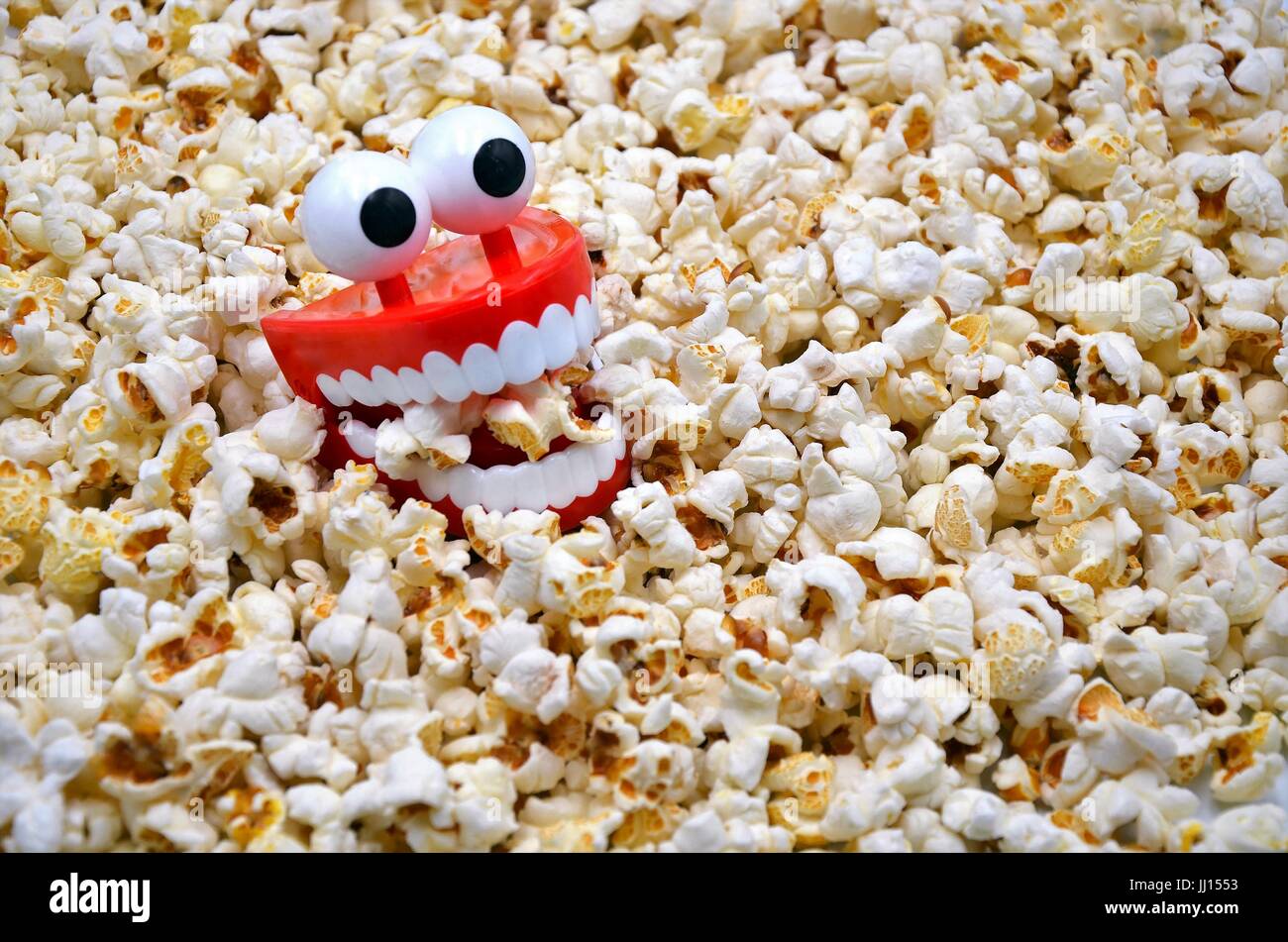 funny teeth toy in popcorn Stock Photo Alamy