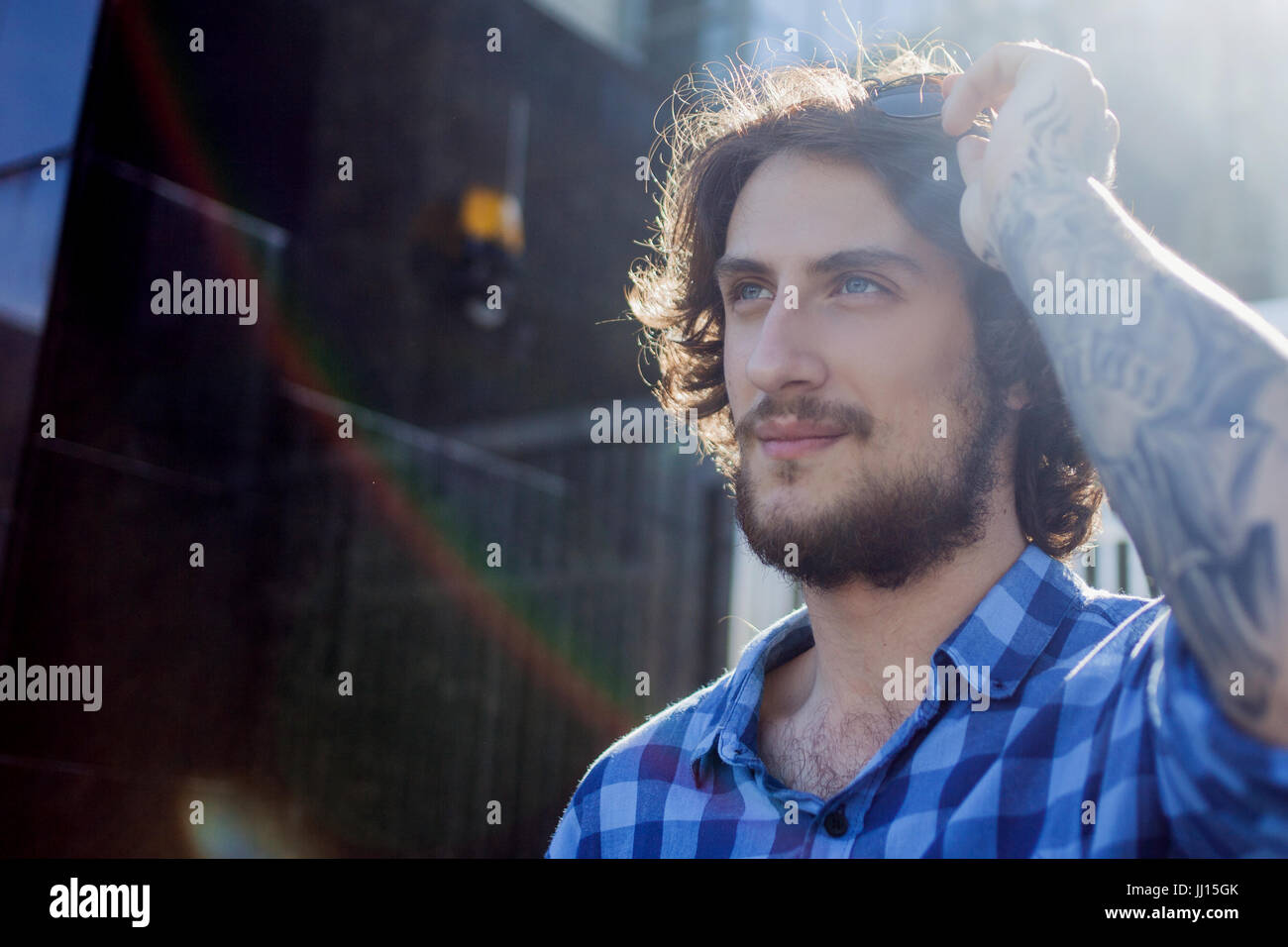 Portrait of young handsome stylish man on the street Stock Photo - Alamy
