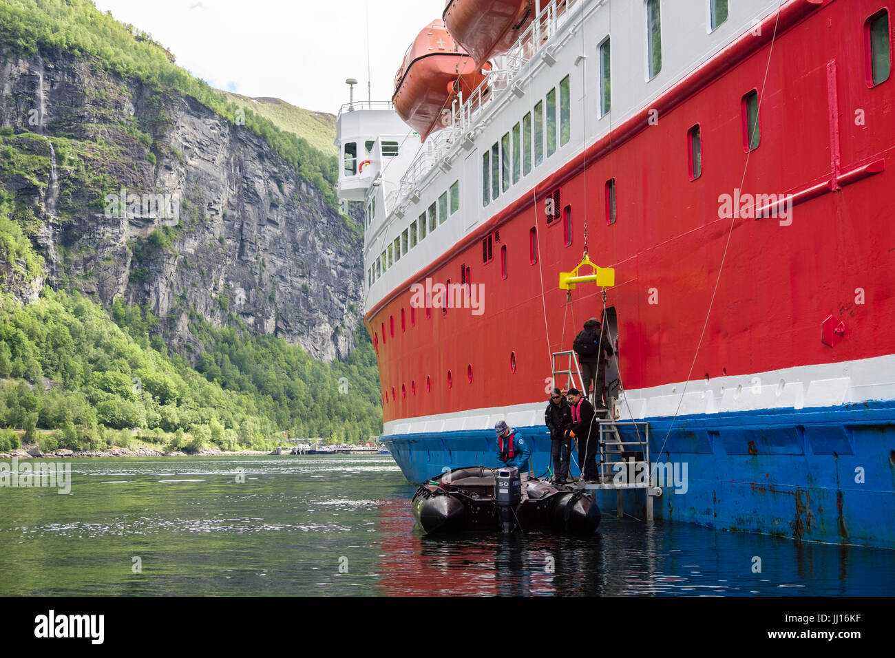 Passengers returning from Zodiac dinghy boat onto G Adventures Cruise