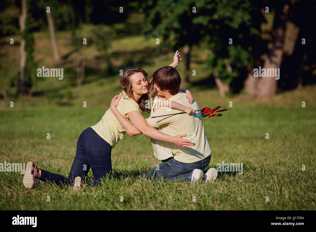 Happy family playing in the park Stock Photo - Alamy
