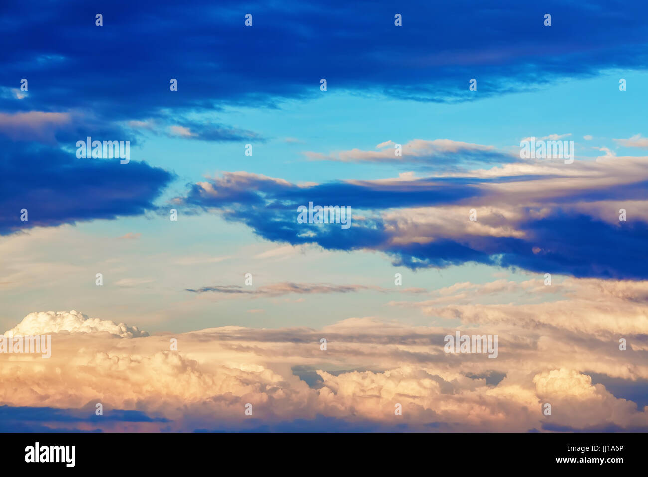 Scenic sunset sky with picturesque cumulus clouds Stock Photo - Alamy