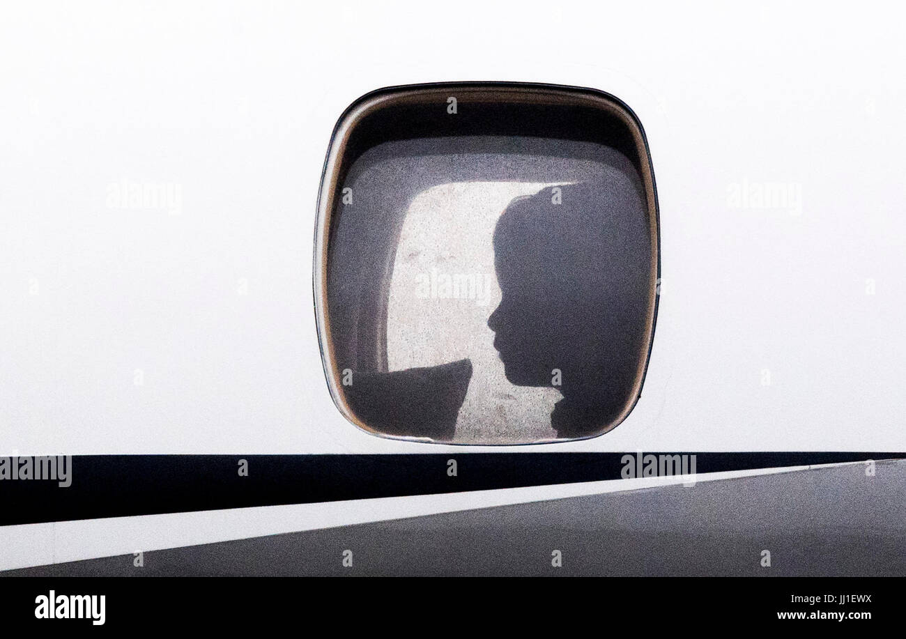 Prince George inside the plane as he arrives with the Duke and Duchess of Cambridge at Warsaw's Chopin Airport for the start of their five-day tour of Poland and Germany. Stock Photo