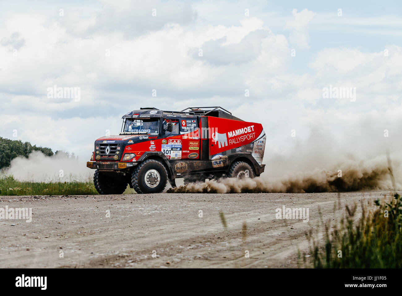 french truck rally car Renault driving on a dusty road during Silk way ...