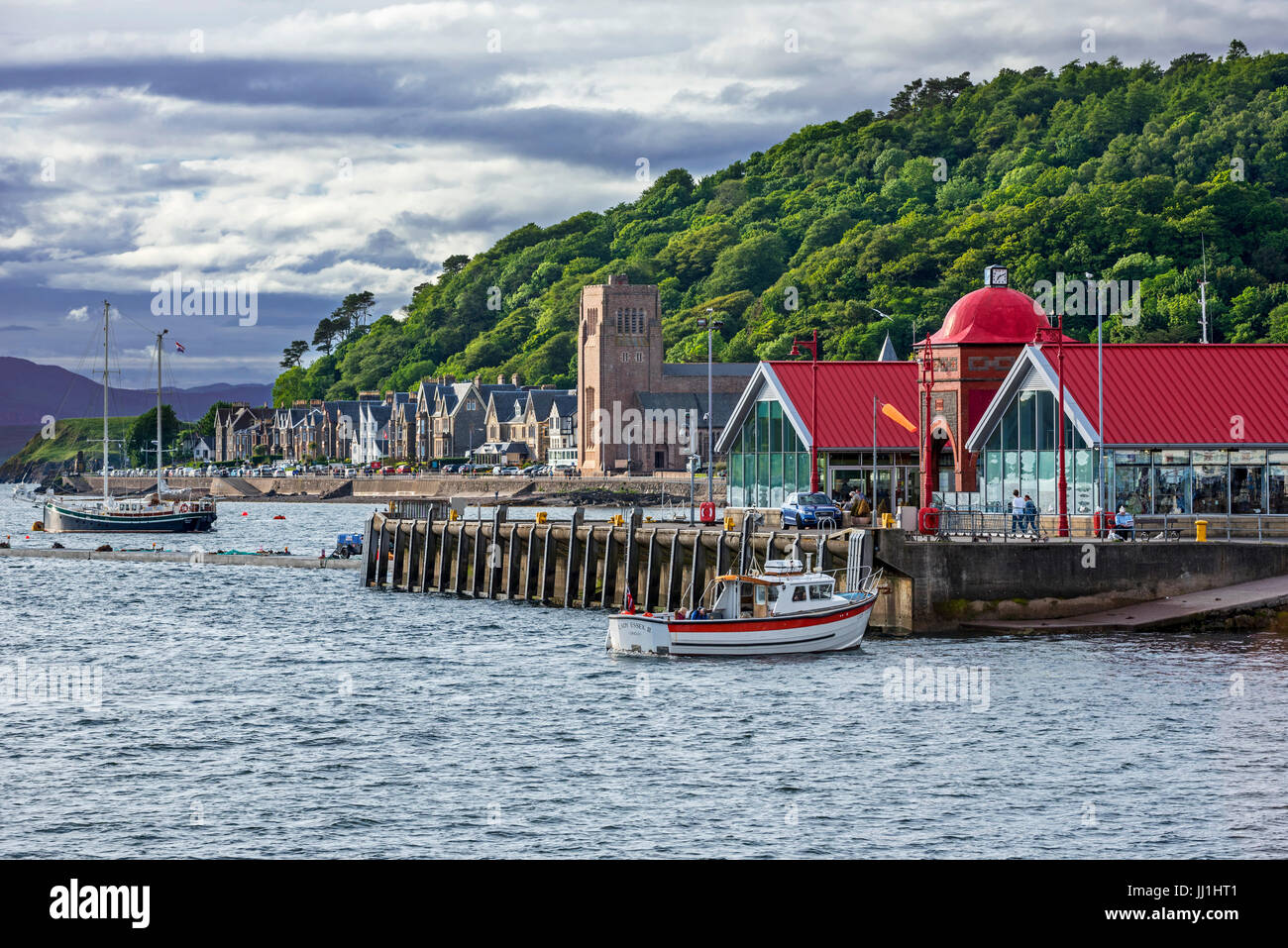 North Pier with Ee-Usk seafood restaurant and St Columba's Cathedral and Oban, Argyll and Bute, Scotland Stock Photo